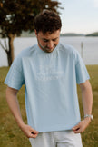 I Live Where People Vacation – Core Tee (Sky Blue Edition)