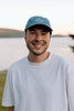 I Live Where People Vacation – Denim Cap