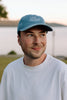 I Live Where People Vacation – Denim Cap